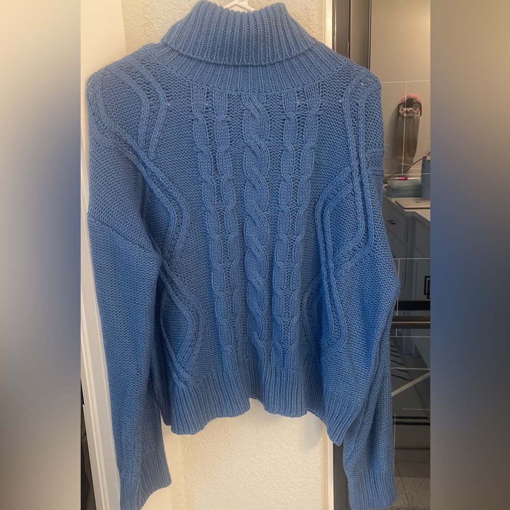 blue turtleneck sweater